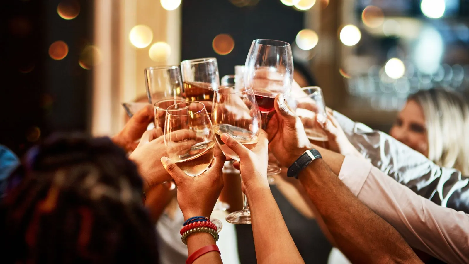 Friends raising glasses at a birthday celebration